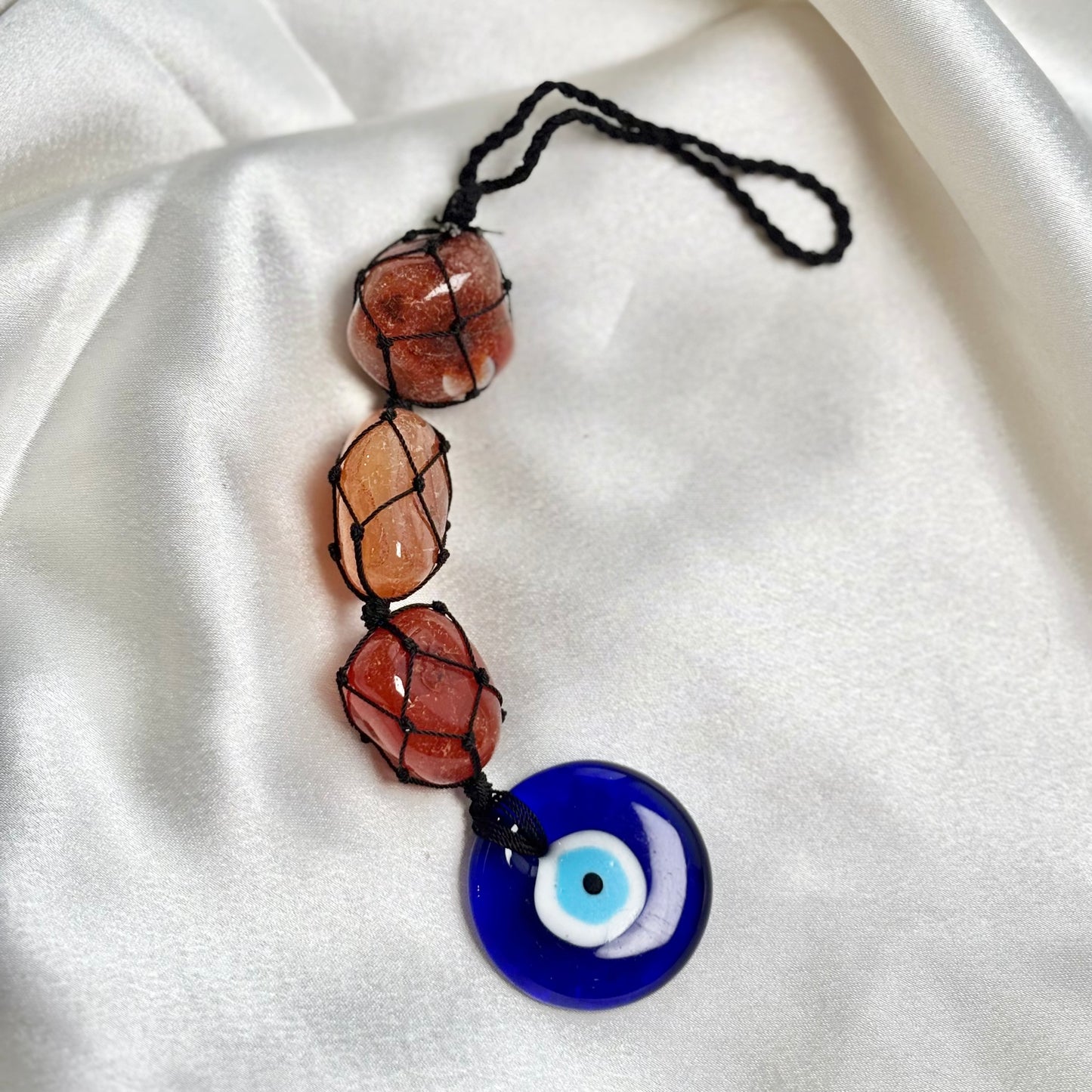 Orange Carnelian Tumble Dangler with Evil Eye Charm?