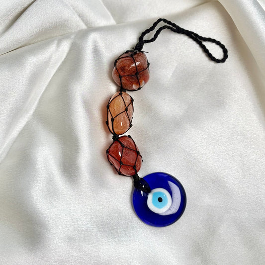 Orange Carnelian Tumble Dangler with Evil Eye Charm?